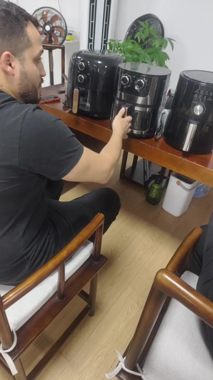Middle East appliance buyer reviewing air fryer samples during a factory visit
